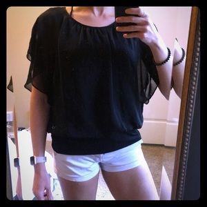 Black blouse with loose mesh over lay